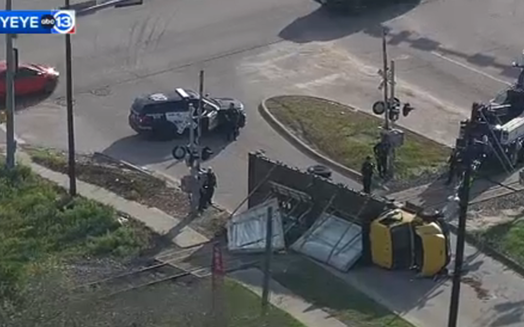 SkyEye video shows truck carrying glass overturned on train tracks at West Tidwell and Hempstead in northwest Houston