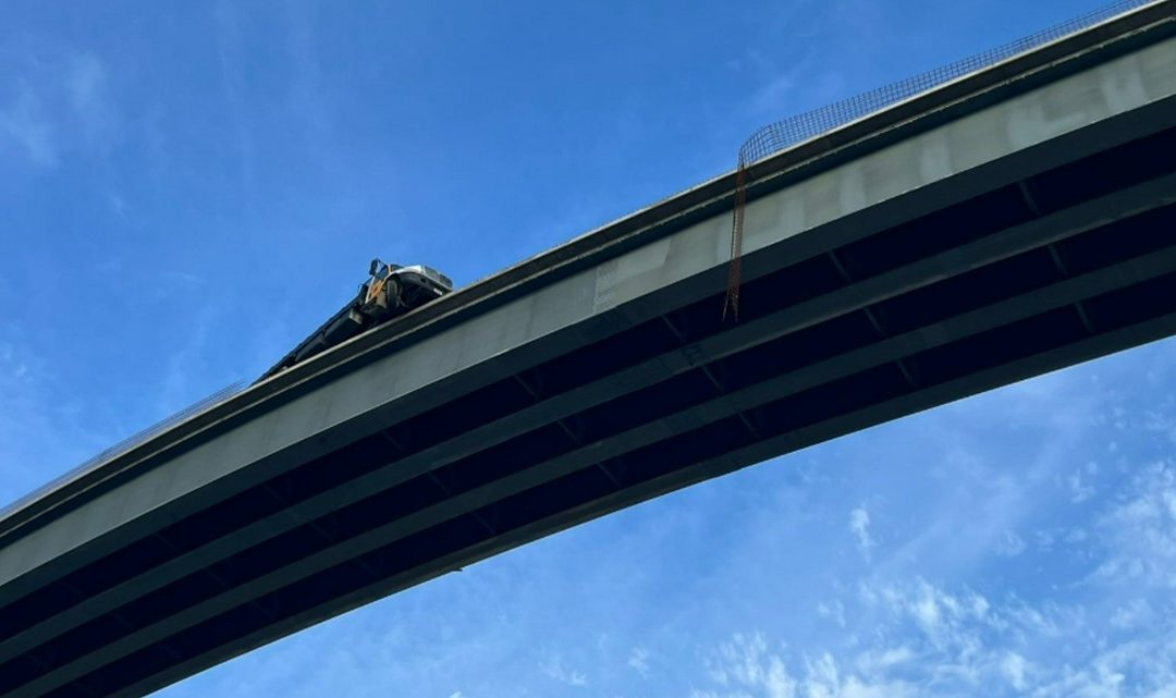 Truck dangling from Westpark Tollway flyover at Grand Parkway